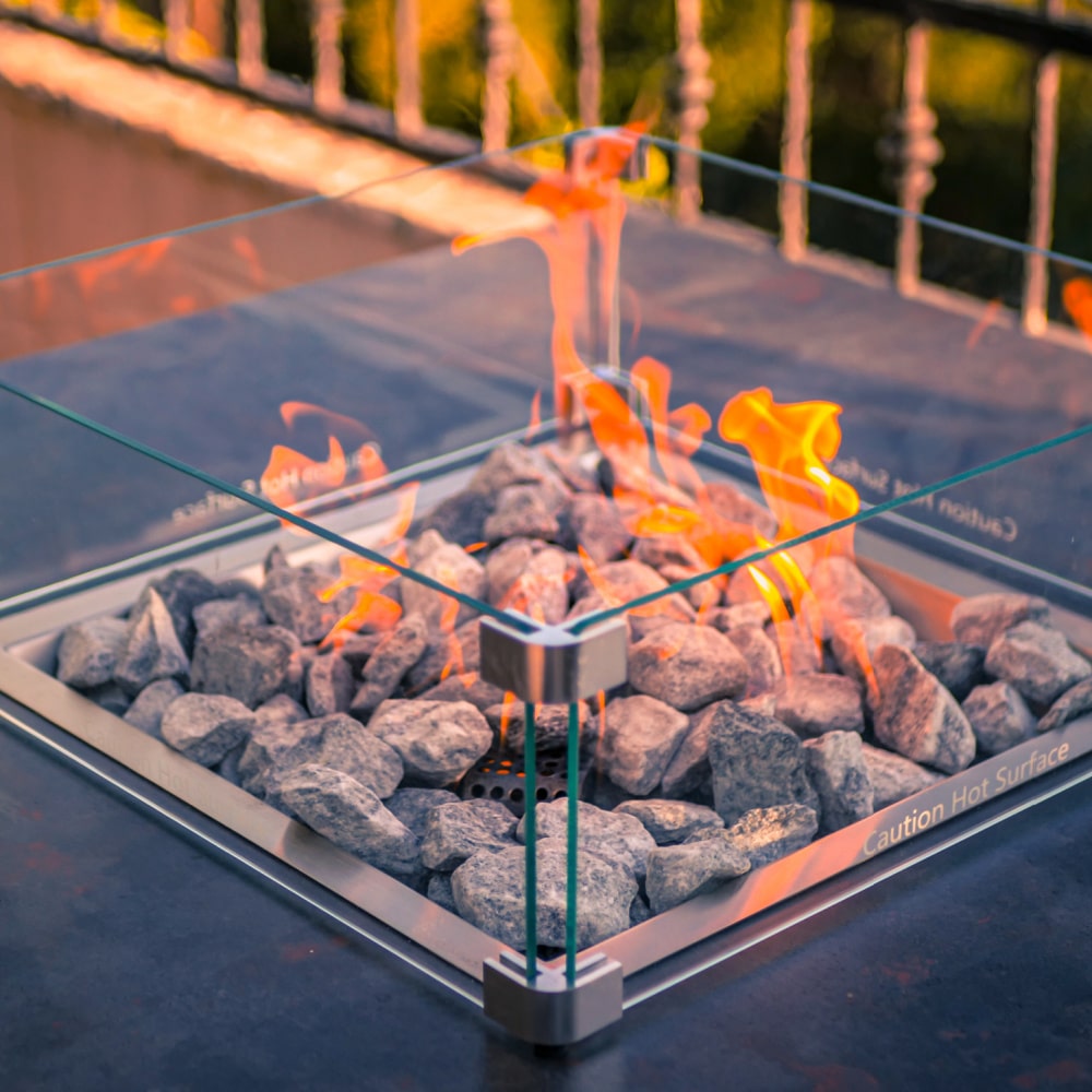 engasco slava low gas fire table hospitality close up flame and rock view