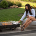 planika rio table outdoor gas fireplace people sat enjoying coffee next to fireplace view