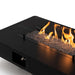 planika rio table outdoor gas fireplace close up flame and rock view