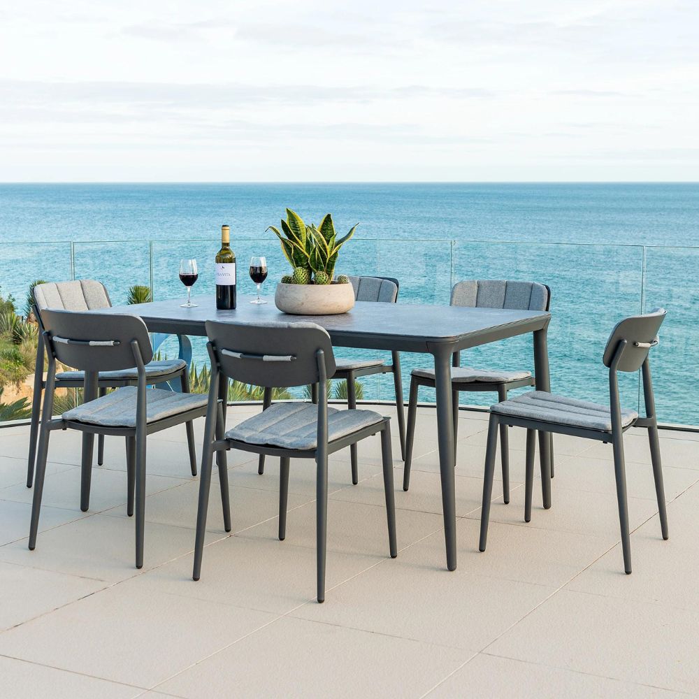 alexander rose rimini aluminium dining set  6 seater rectangular table with bottle of wine view