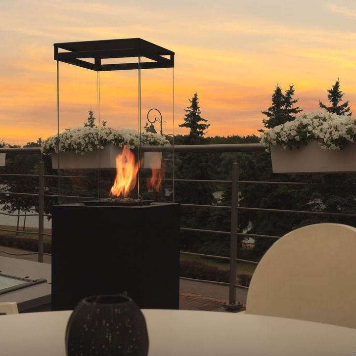 planika faro outdoor gas patio heater hospitality next to dining table view